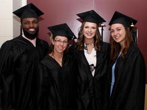 graduates in cap and gown at commencement